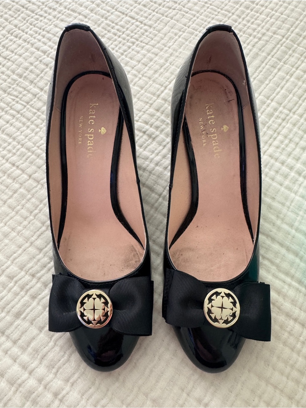 kate spade Black Patent Leather Bow Pumps with Gold Medallion